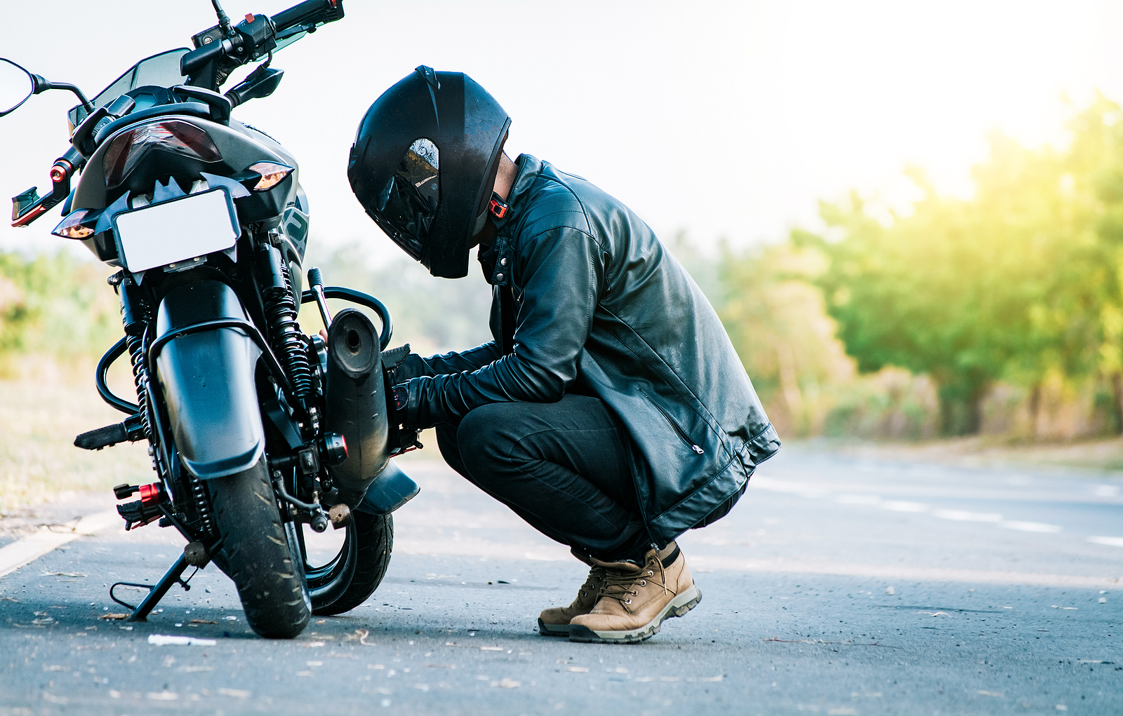 Man next to motorcycle - Motorcycle Accident Lawyers - WHG