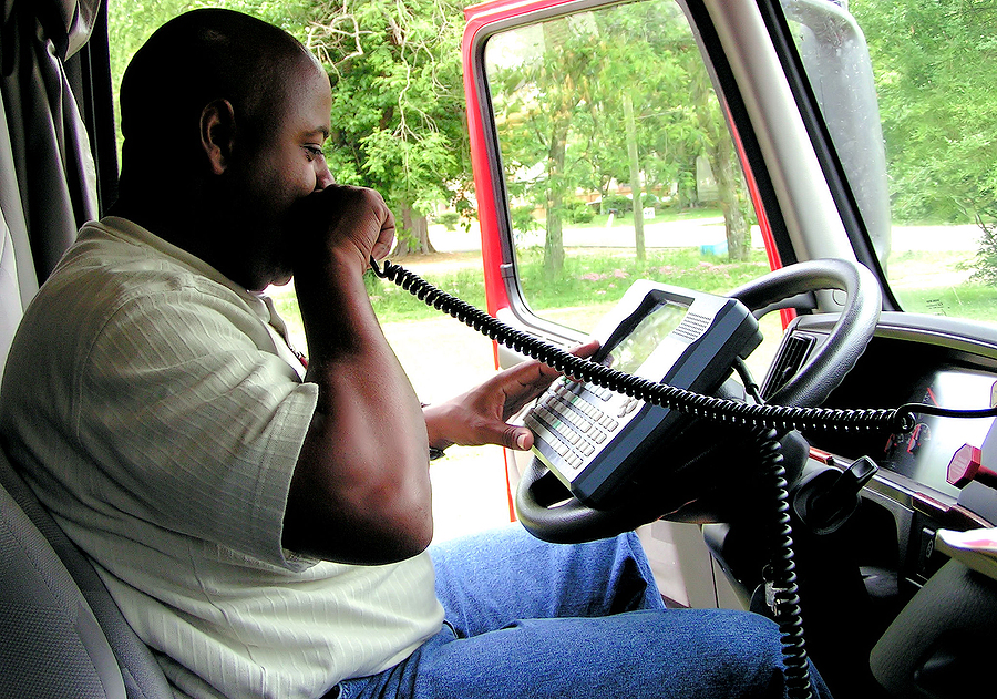 Truck driver talking on his radio