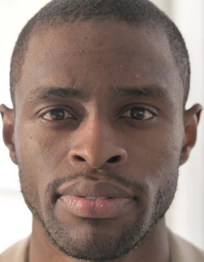 A headshot Image of a Black Man