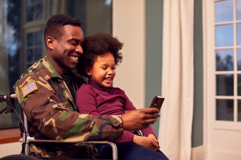 Vet sitting with his daughter