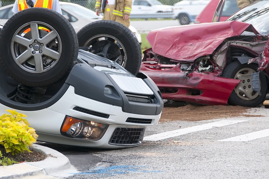 scene of a rollover crash where drivers may have car accident injury claims