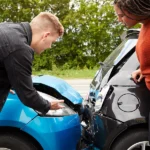 Man gathers evidence after rear end collision to support future legal strategies for maximizing his compensation in car crash claim