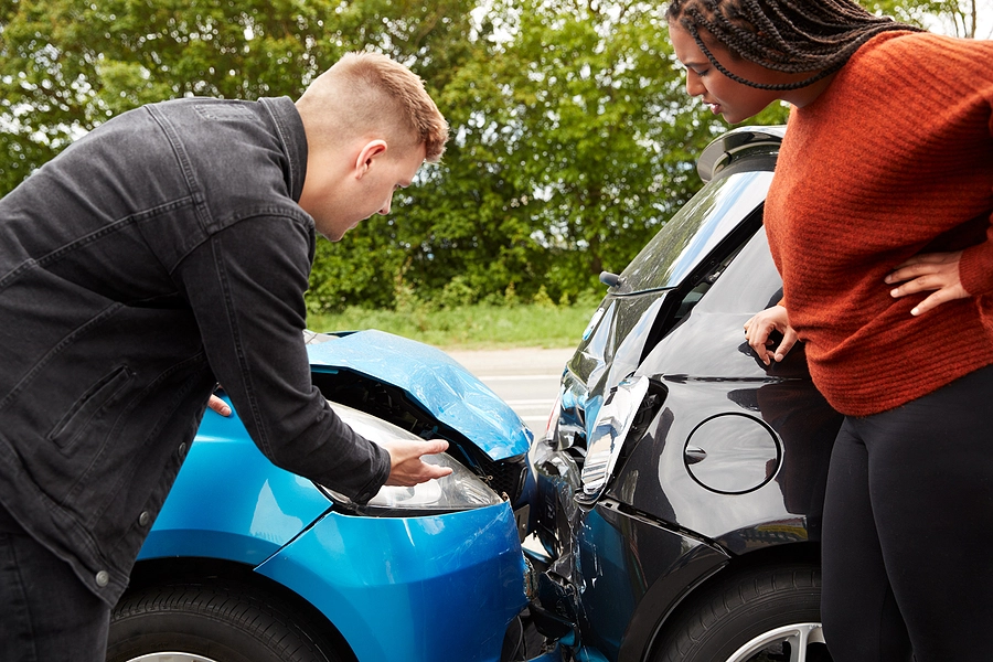 Man gathers evidence after rear end collision to support future legal strategies for maximizing his compensation in car crash claim