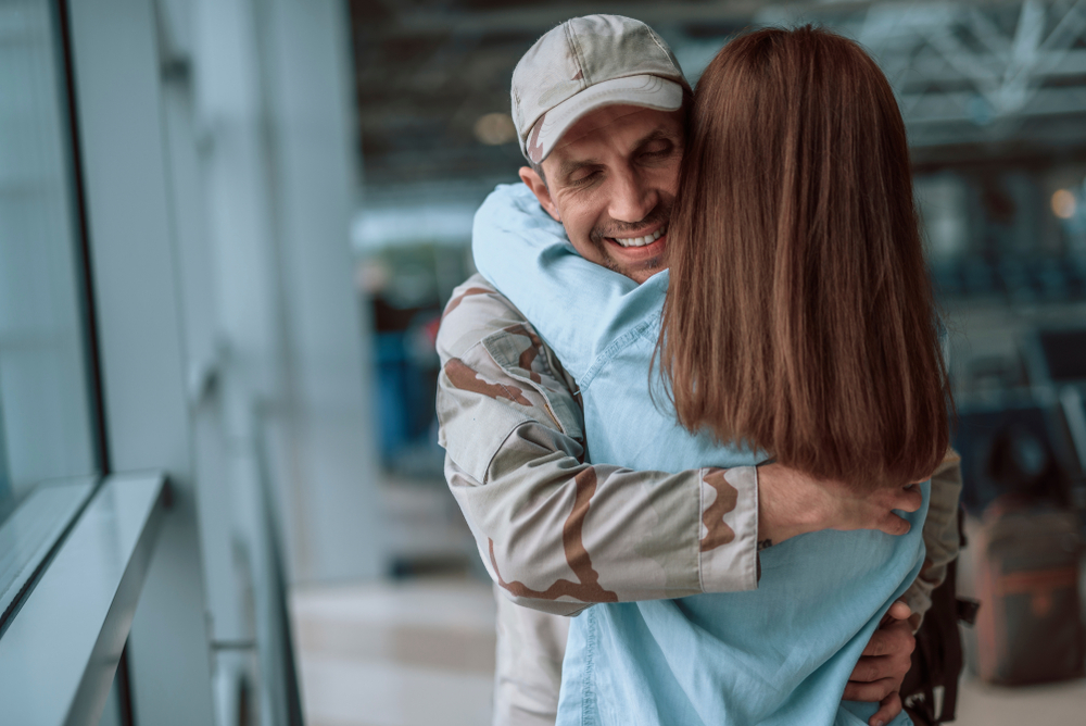 American soldier greets wife at airport after deployment - WHG