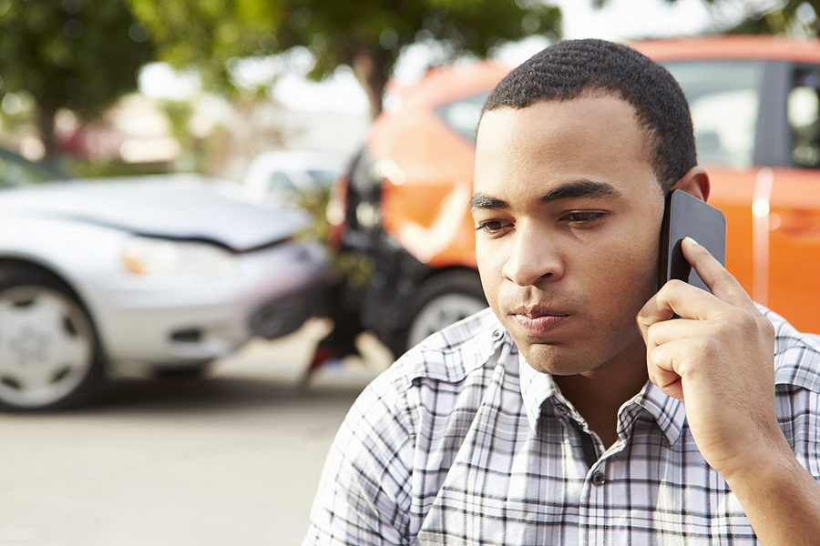 young man calling a hollywood personal injury lawyer after getting into a rear-end car accident