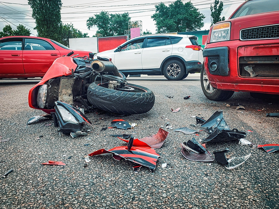 aftermath of a florida motorcycle accident involving three cars and one injured rider