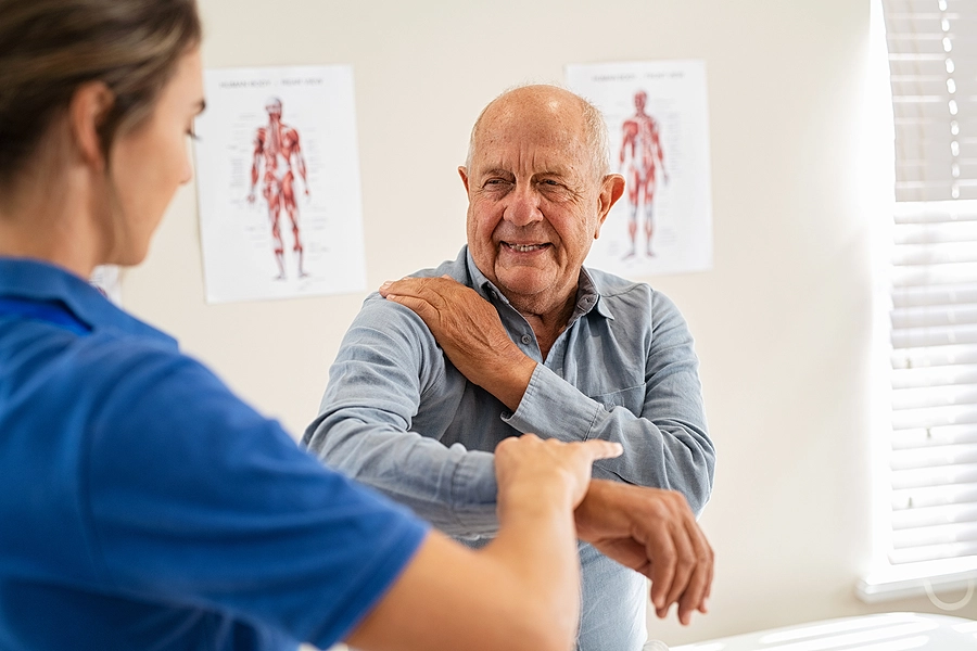 older florida veteran undergoes a physical therapy session for a service-related arm injury