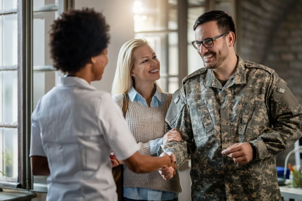 Military veteran and his wife speaking to VA healthcare provider