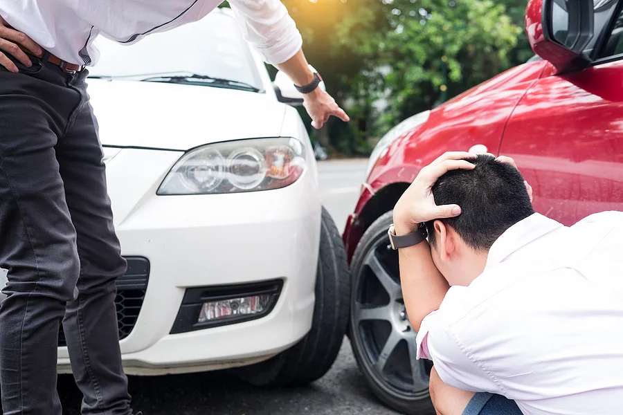 One driver yelling at another driver for damaging his car