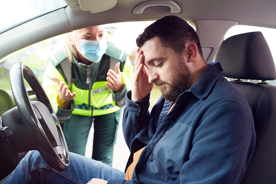 a wellington car accident victim with a head injury receives help from a paramedic