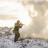 Military service member trying to avoid blast injuries from a nearby explosion in a combat zone during winter